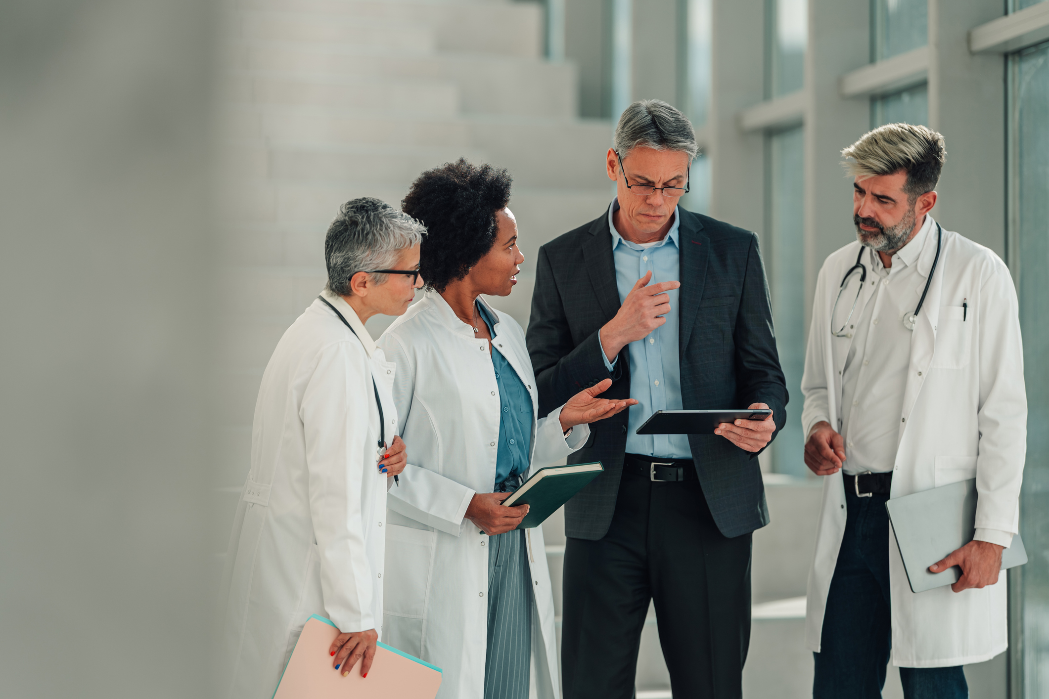 Healthcare provider leadership team reviewing compliance data