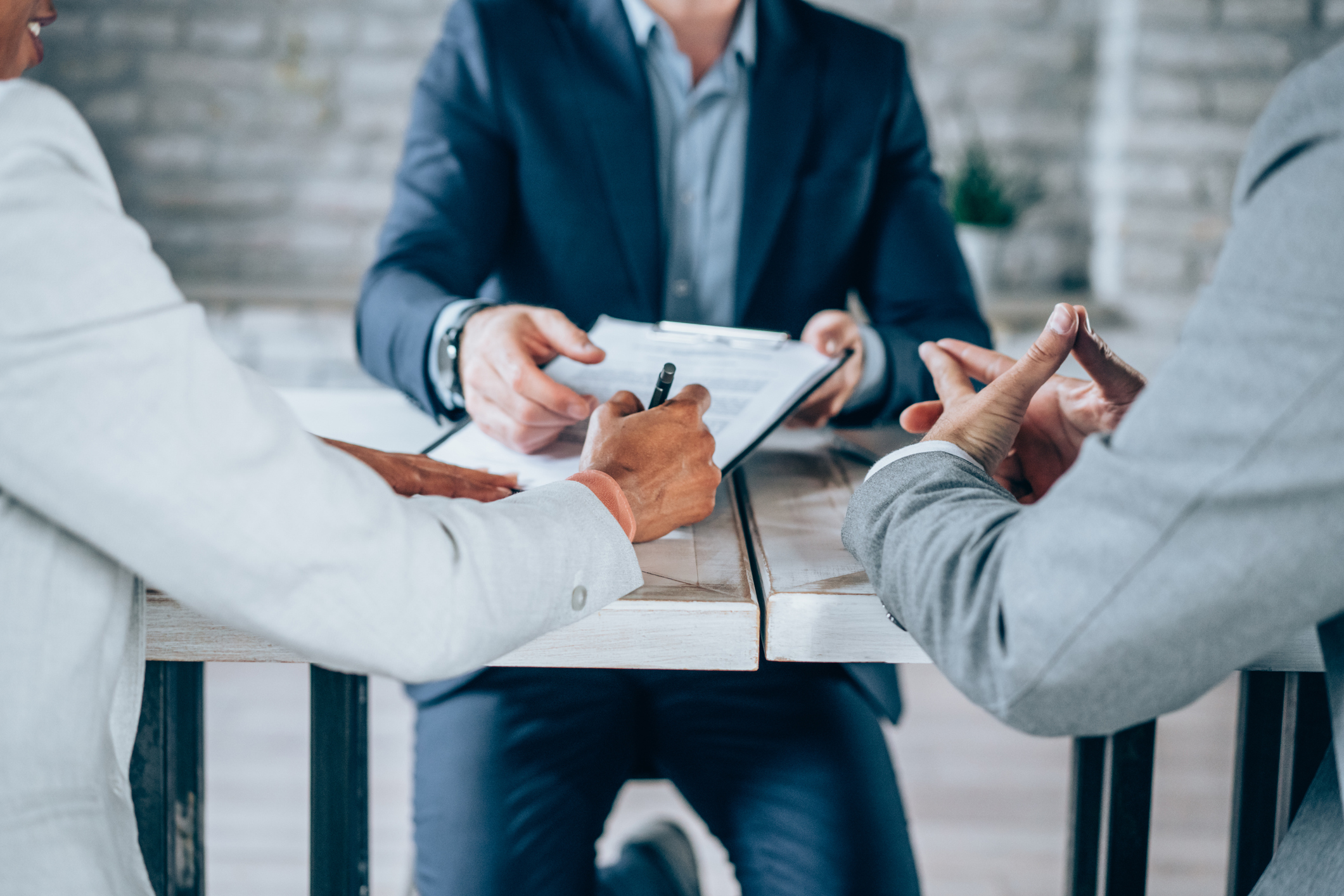 Healthcare professionals discussing practice compliance in a medical office
